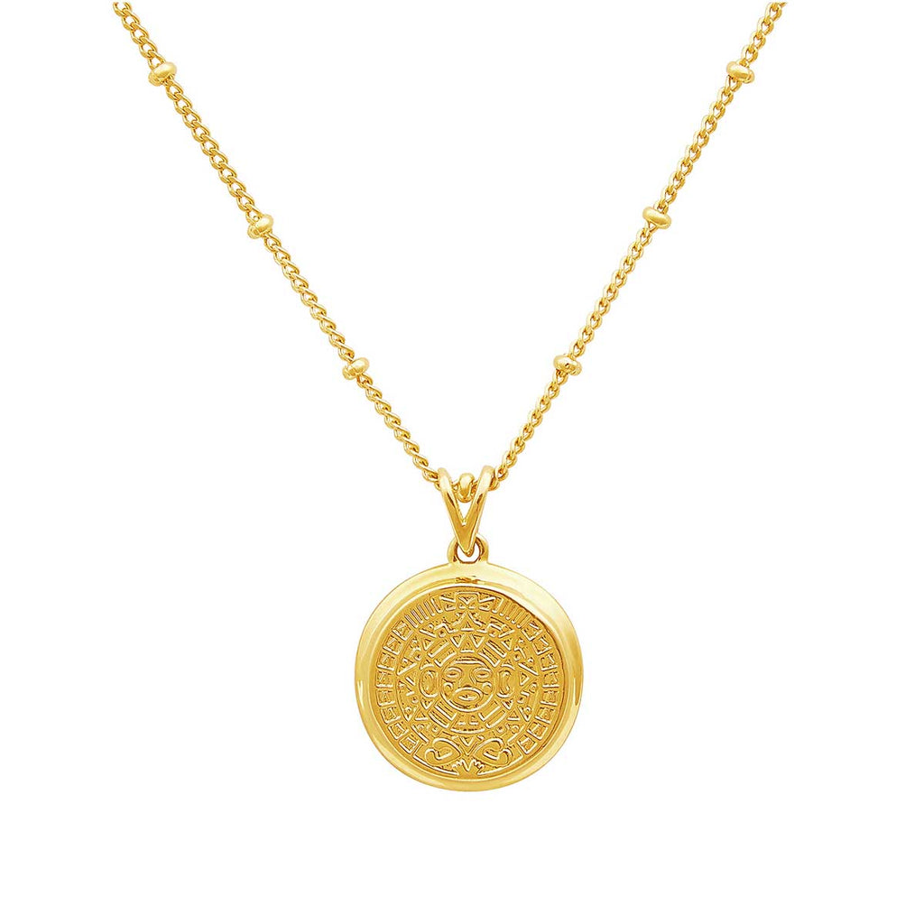 gold coin necklace on white background 