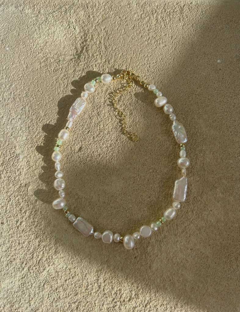 pearl necklace on the stone bakcground