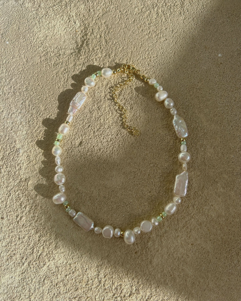 gold pearl choker in sandy stone