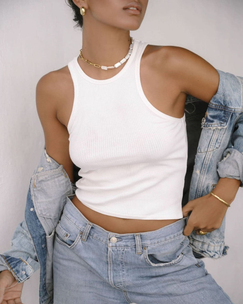 pearl choker necklace styled with white tank top and denim