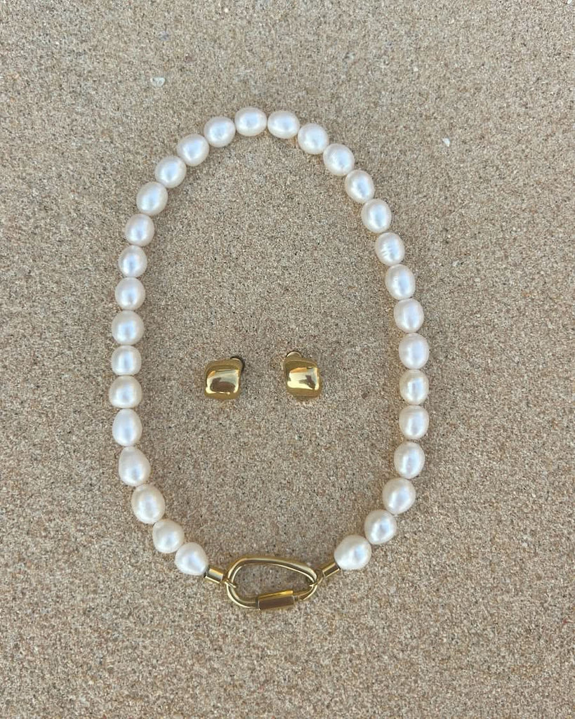 CULT OF SUN pearl carabiner necklace at the beach