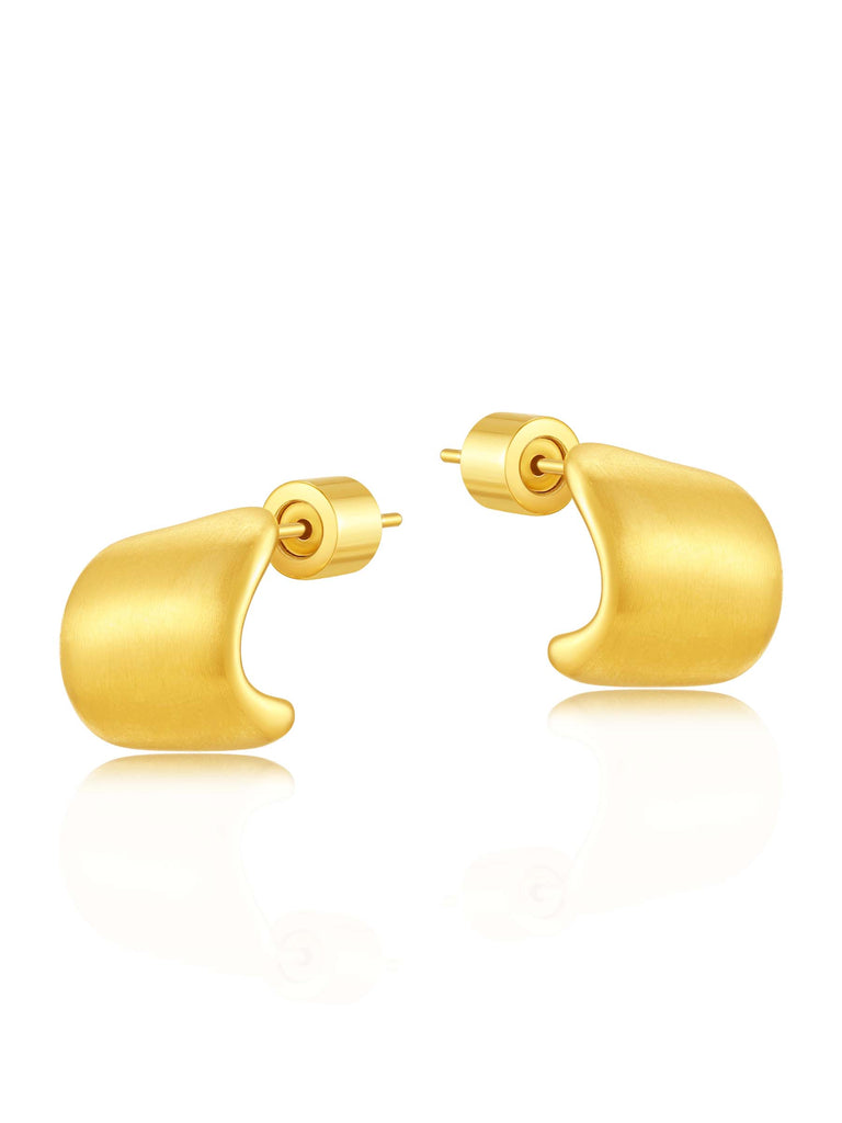 small gold earrings on white background