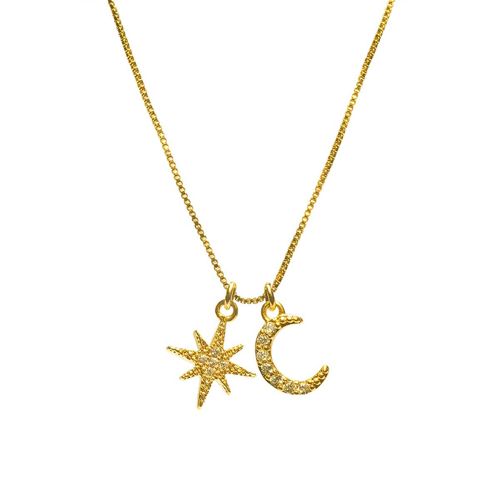 crescent moon and star necklace on white background 