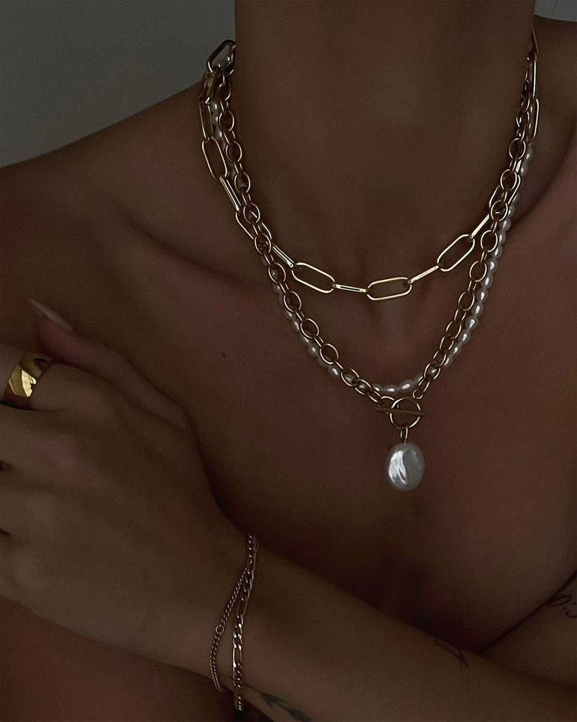 close up neck and arm featuring Cult of Sun jewelry 
