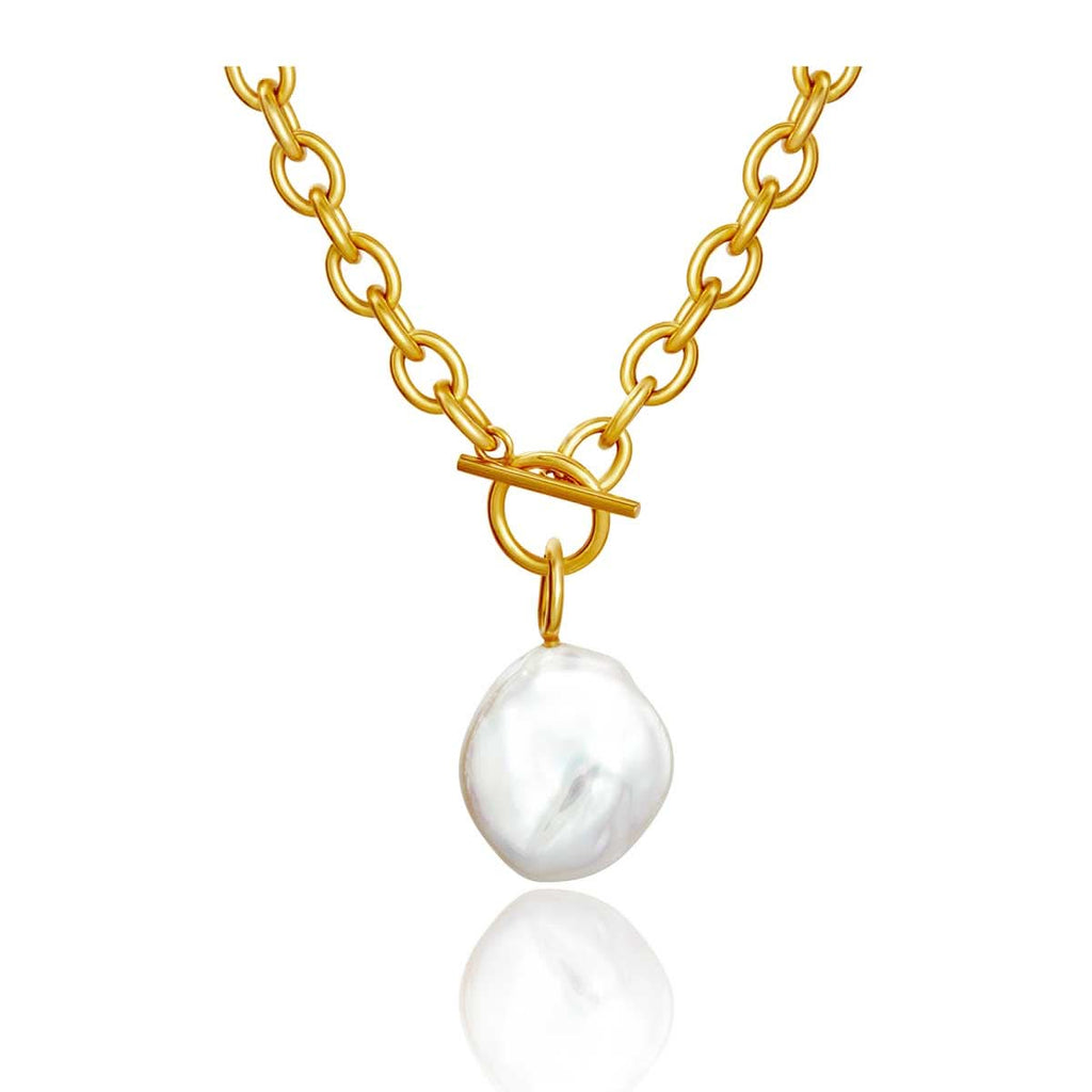 chunky gold chain featuring large baroque pearl necklace on white background