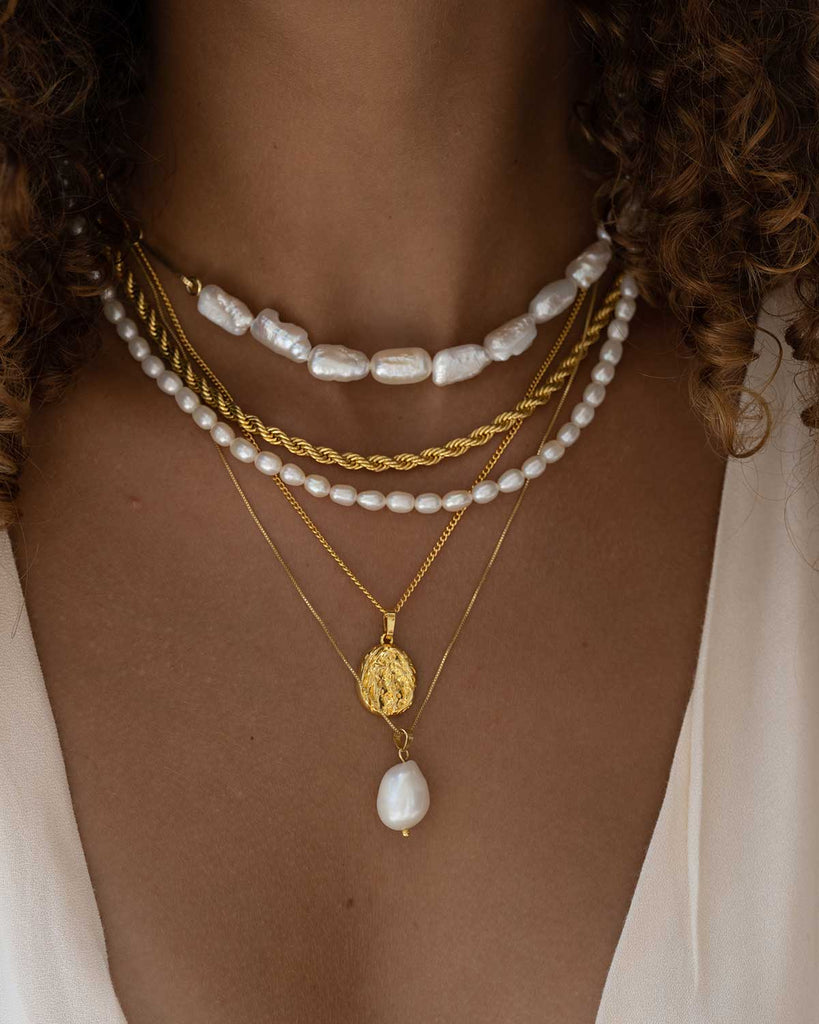 half pearl half choker necklace, twisted chain, dainty pearl necklace, gold crested coin necklace, and large baroque pearl necklace