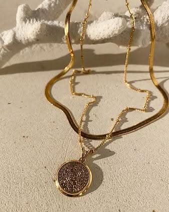Aztec coin necklace and Herringbone Chain Choker on coral 