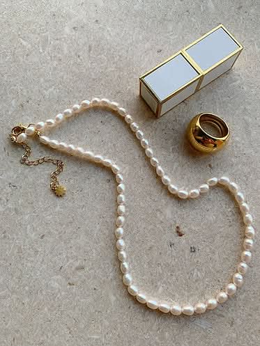 seed pearl necklace and dome gold ring 