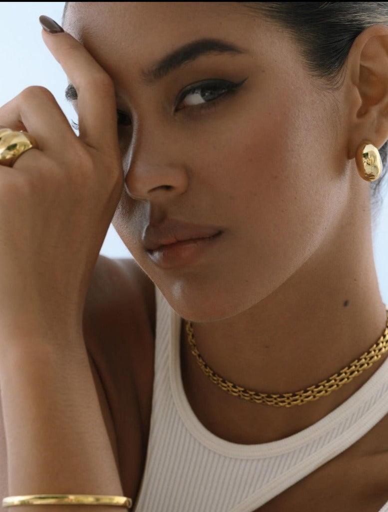 set of gold choker, earrings, bracelet and rings